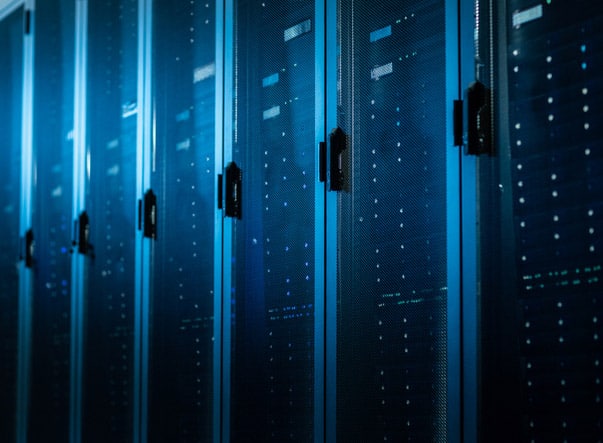 Low Angle Shot of a Working Data Center With Rows of Rack Servers. Led Lights Blinking and Computers are Working.