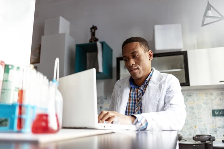 Scientist using computer in laboratory